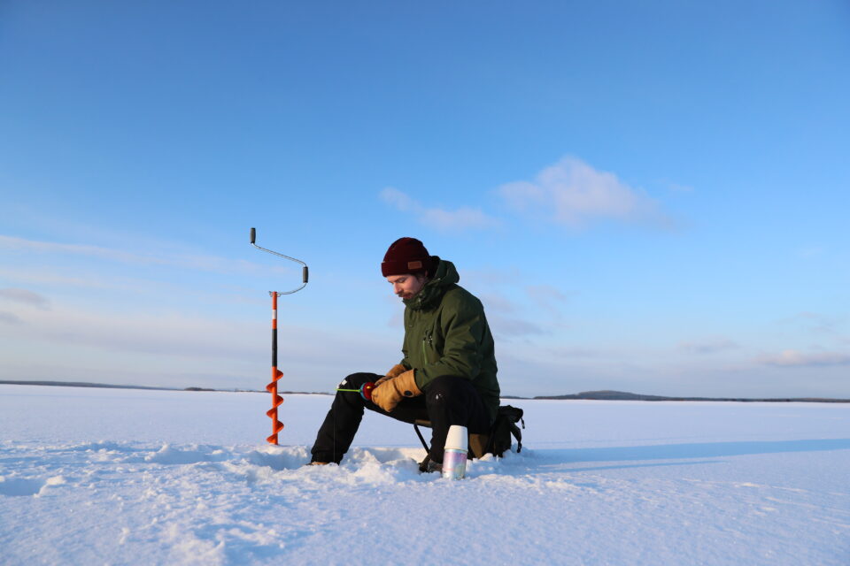 A man icefishing in Kemijärvi.